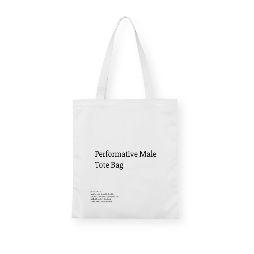 A stylish canvas tote bag featuring a self-aware aesthetic, designed for the modern male shopper. The bag showcases a unique performative design, blending functionality with contemporary art influences, perfect for carrying everyday essentials.